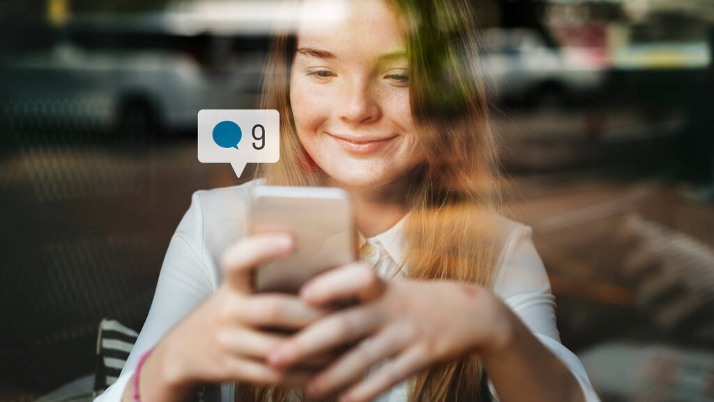 women with her phone using speech recognition