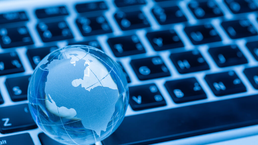 World globe and computer keyboard showing wikipedia and wikidata